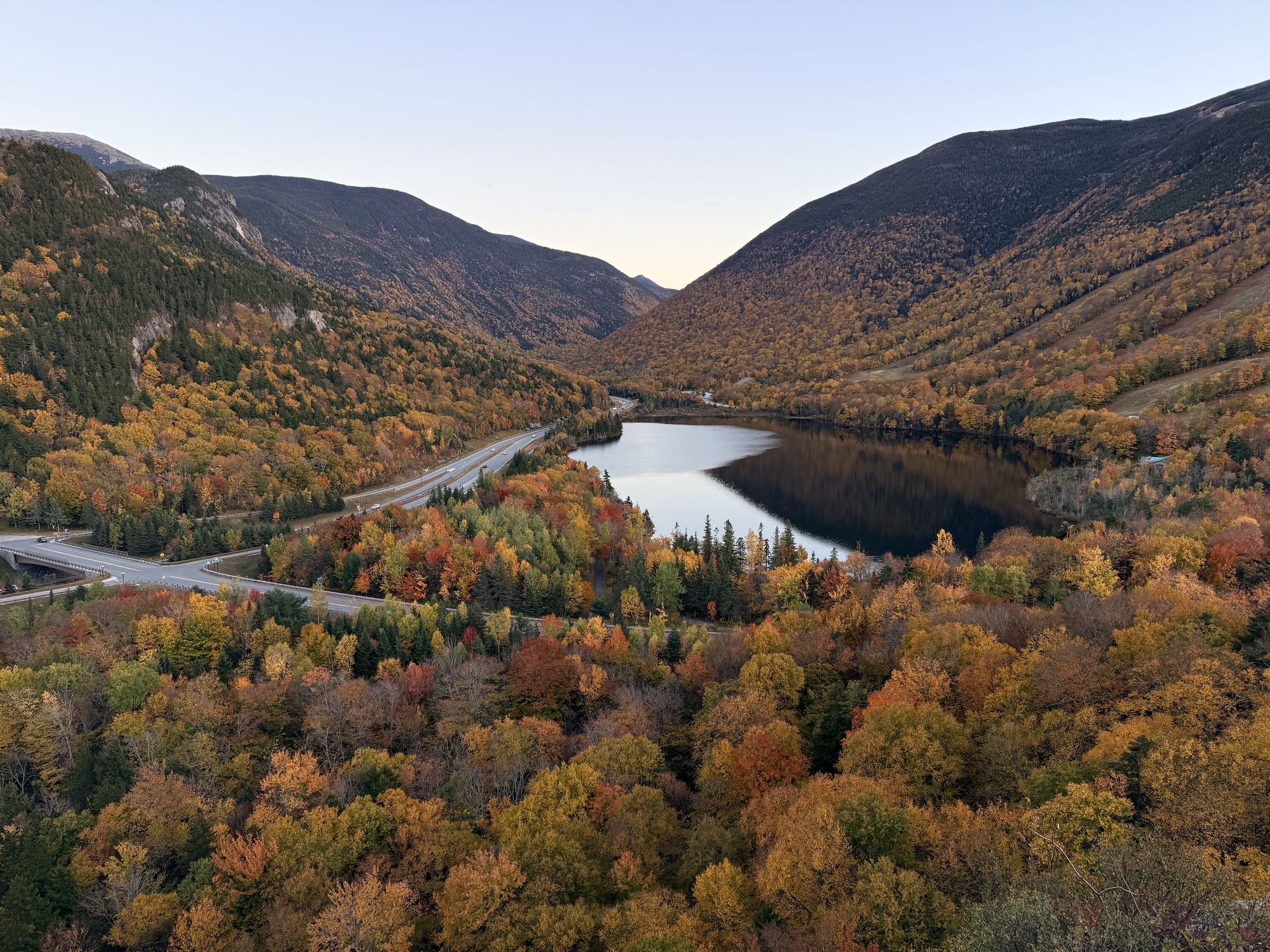 Artist's Bluff. Echo Lake and Franconia Notch at sunset, with I-93 threading through.