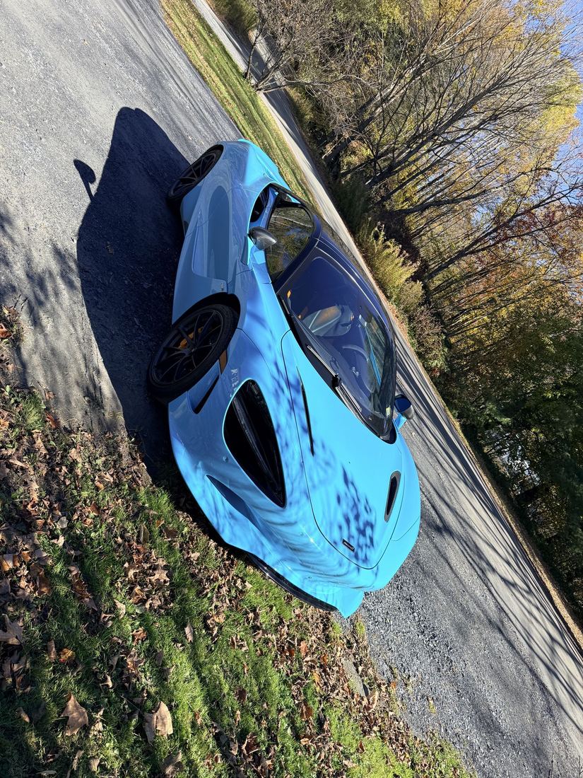 Warren, Vermont. A baby blue McLaren parked out front.