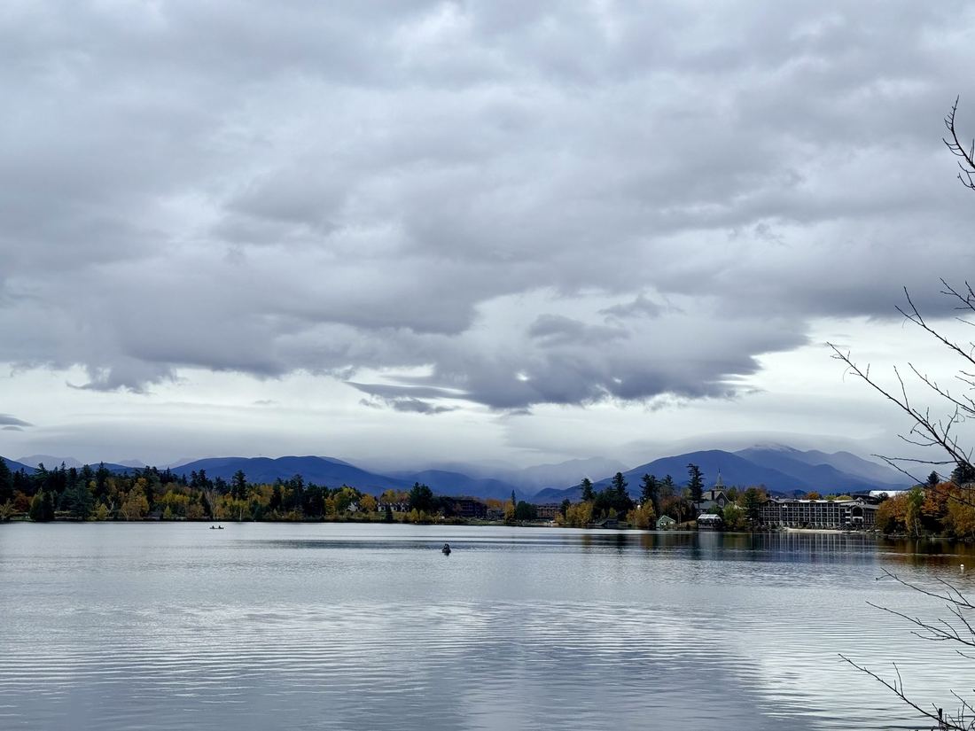 Mirror Lake, Lake Placid. Adirondack peaks under a low, heavy sky.